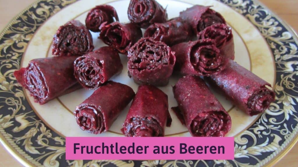 Purple fruit leather rolls on a plate