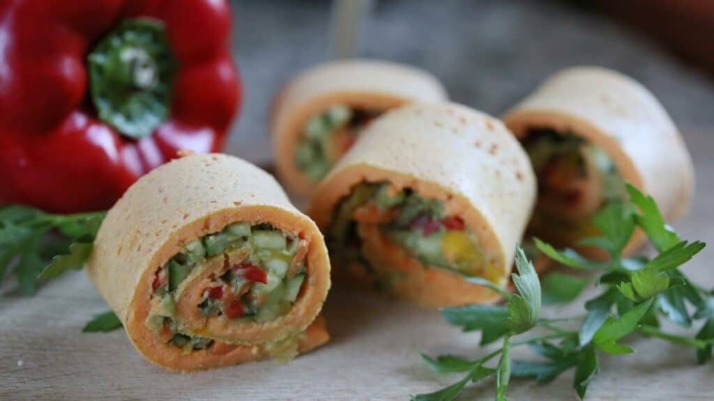 Stuffed avocado veggie pinwheels next to parsley